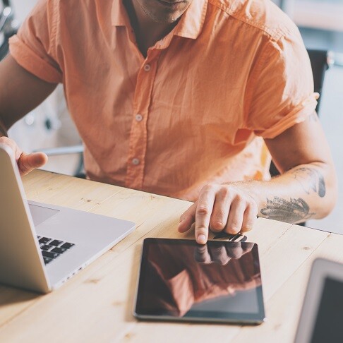 Person Working on Tablet